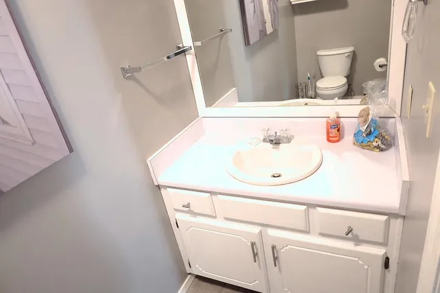 a bathroom with a sink a toilet and bathtub