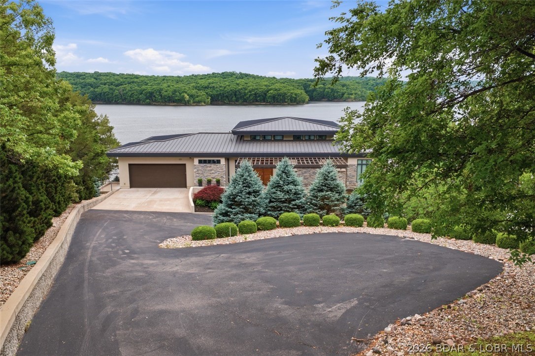 777 Malibu Road Osage Beach, MO 65065 - Photo 18 of 100 As soon as you pull into the gentle driveway, you