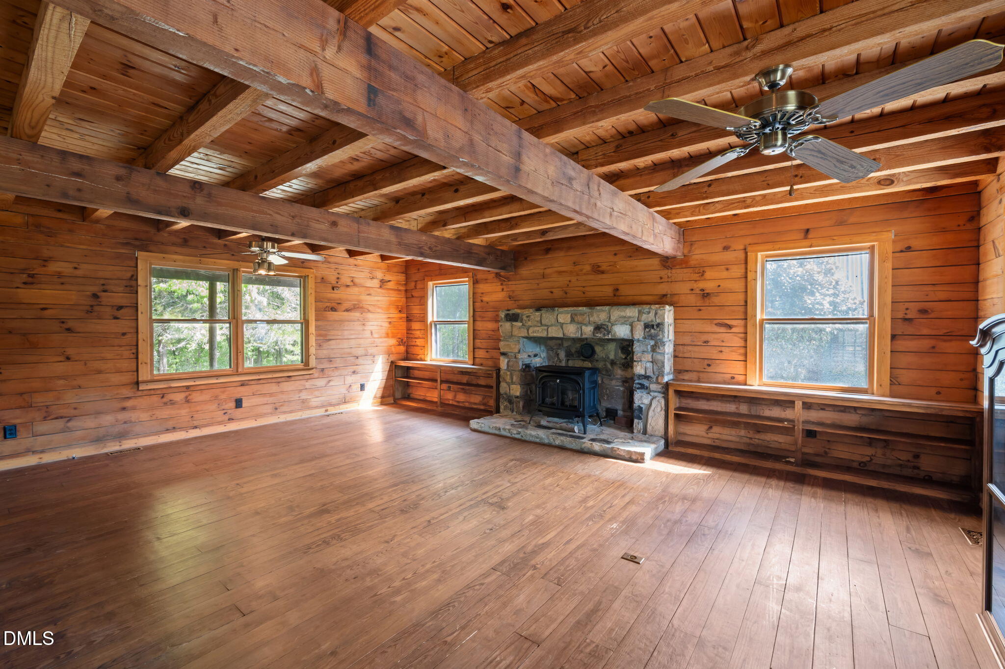 643 Old Stonehouse Road Chapel Hill, NC 27516 - Photo 17 of 63 a view of empty room with wooden floor and fireplace
