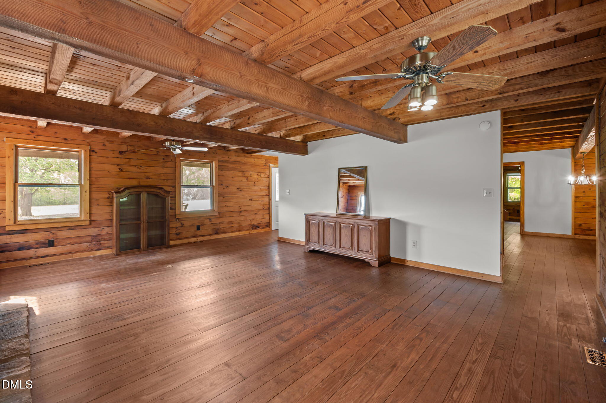 643 Old Stonehouse Road Chapel Hill, NC 27516 - Photo 18 of 63 a view of an empty room with window and wooden floor