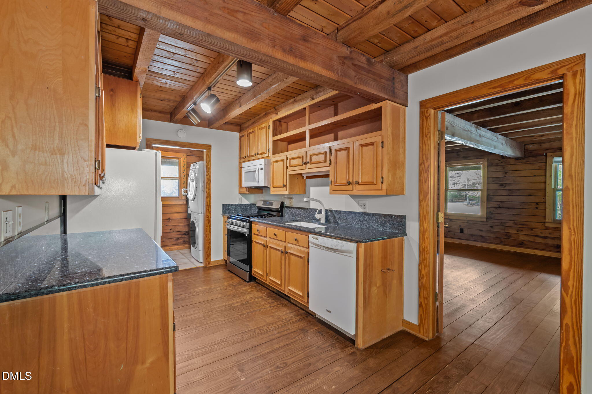 643 Old Stonehouse Road Chapel Hill, NC 27516 - Photo 21 of 63 a kitchen with stainless steel appliances granite countertop wooden floors and sink