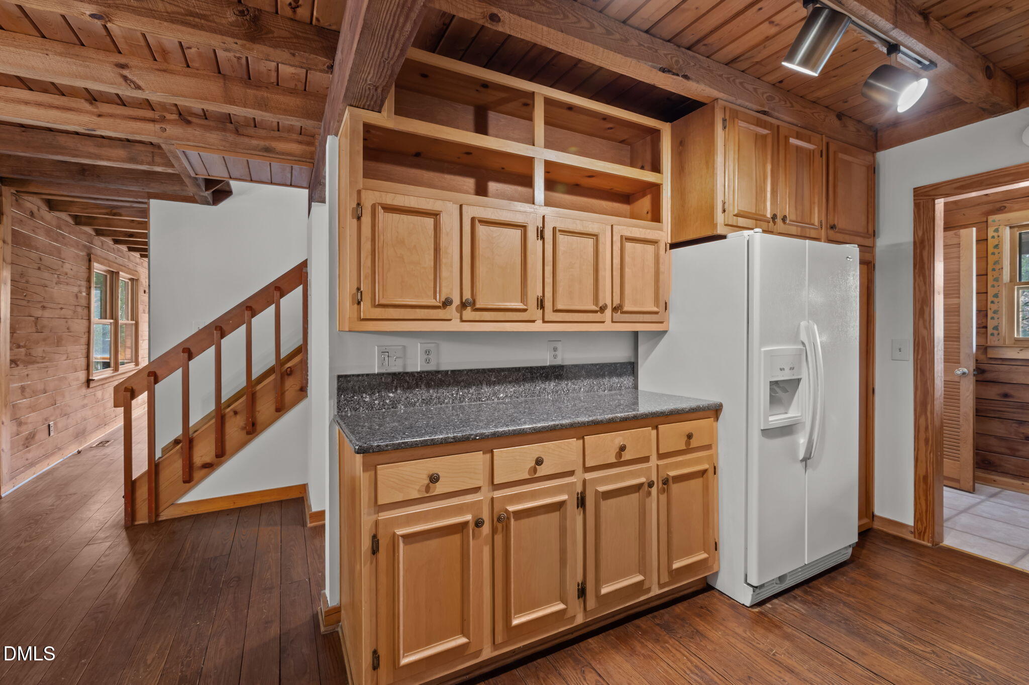 643 Old Stonehouse Road Chapel Hill, NC 27516 - Photo 24 of 63 a kitchen with stainless steel appliances granite countertop a refrigerator and wooden floors