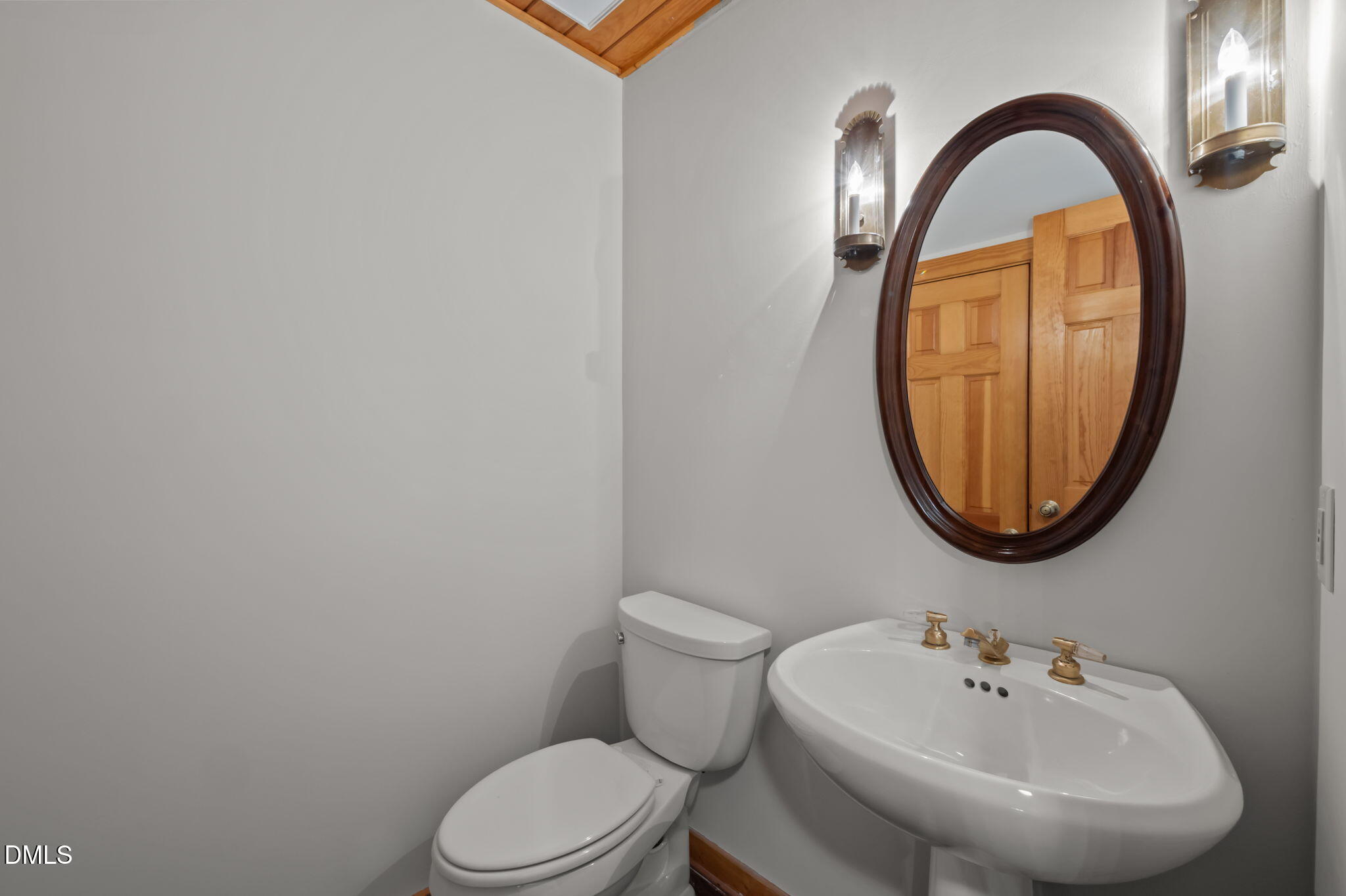 643 Old Stonehouse Road Chapel Hill, NC 27516 - Photo 25 of 63 a bathroom with a sink and a mirror