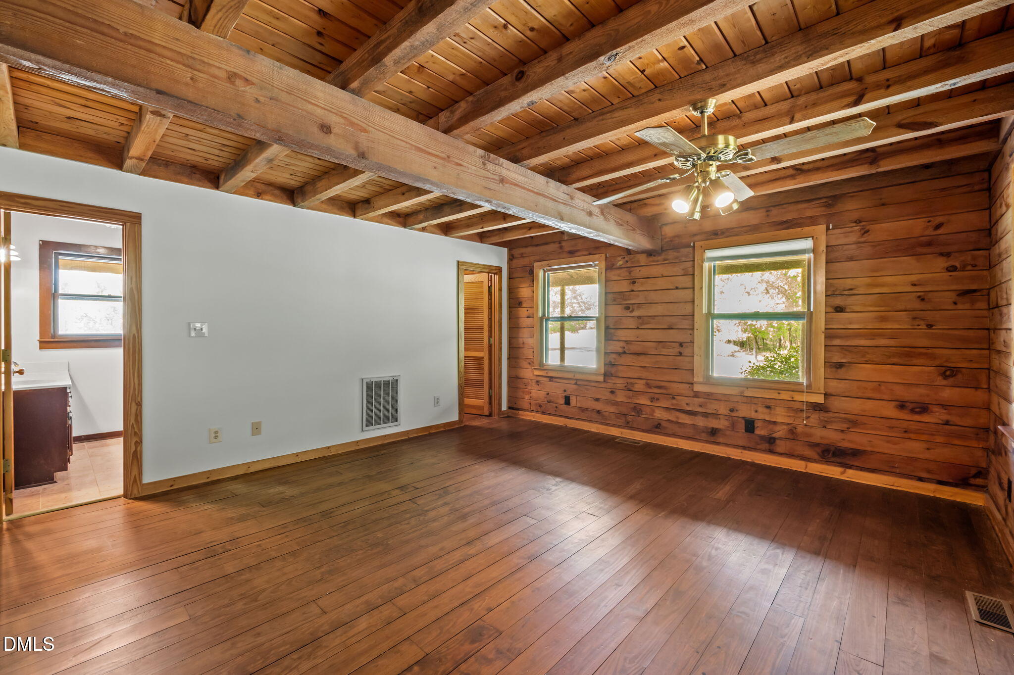 643 Old Stonehouse Road Chapel Hill, NC 27516 - Photo 26 of 63 a view of an empty room with wooden floor and a window