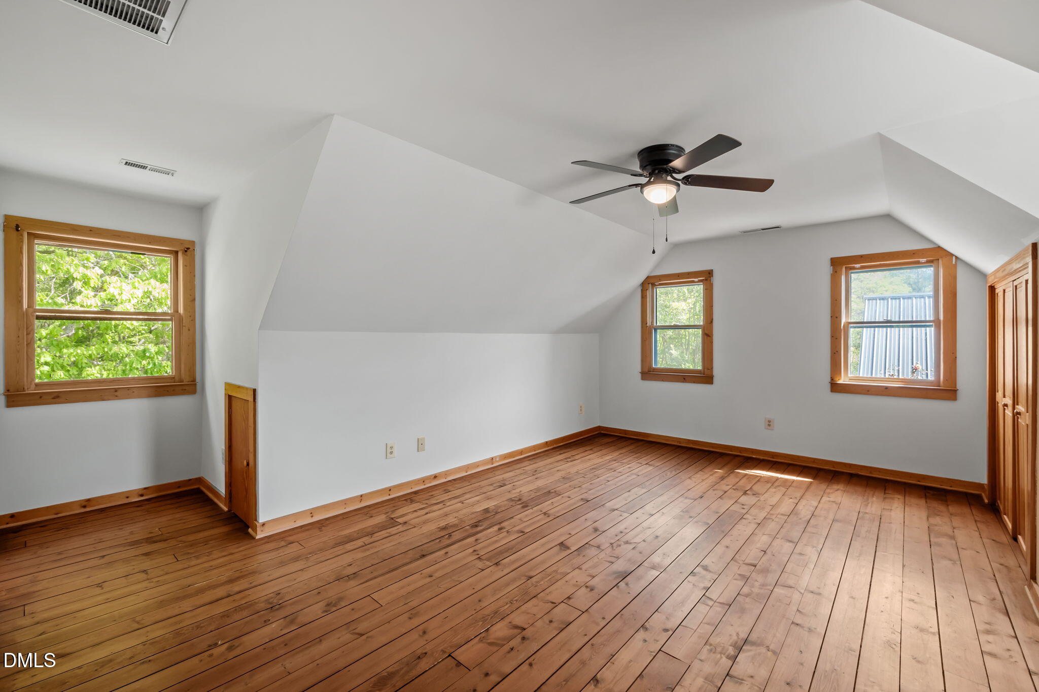 643 Old Stonehouse Road Chapel Hill, NC 27516 - Photo 32 of 63 a view of an empty room with a window and wooden floor