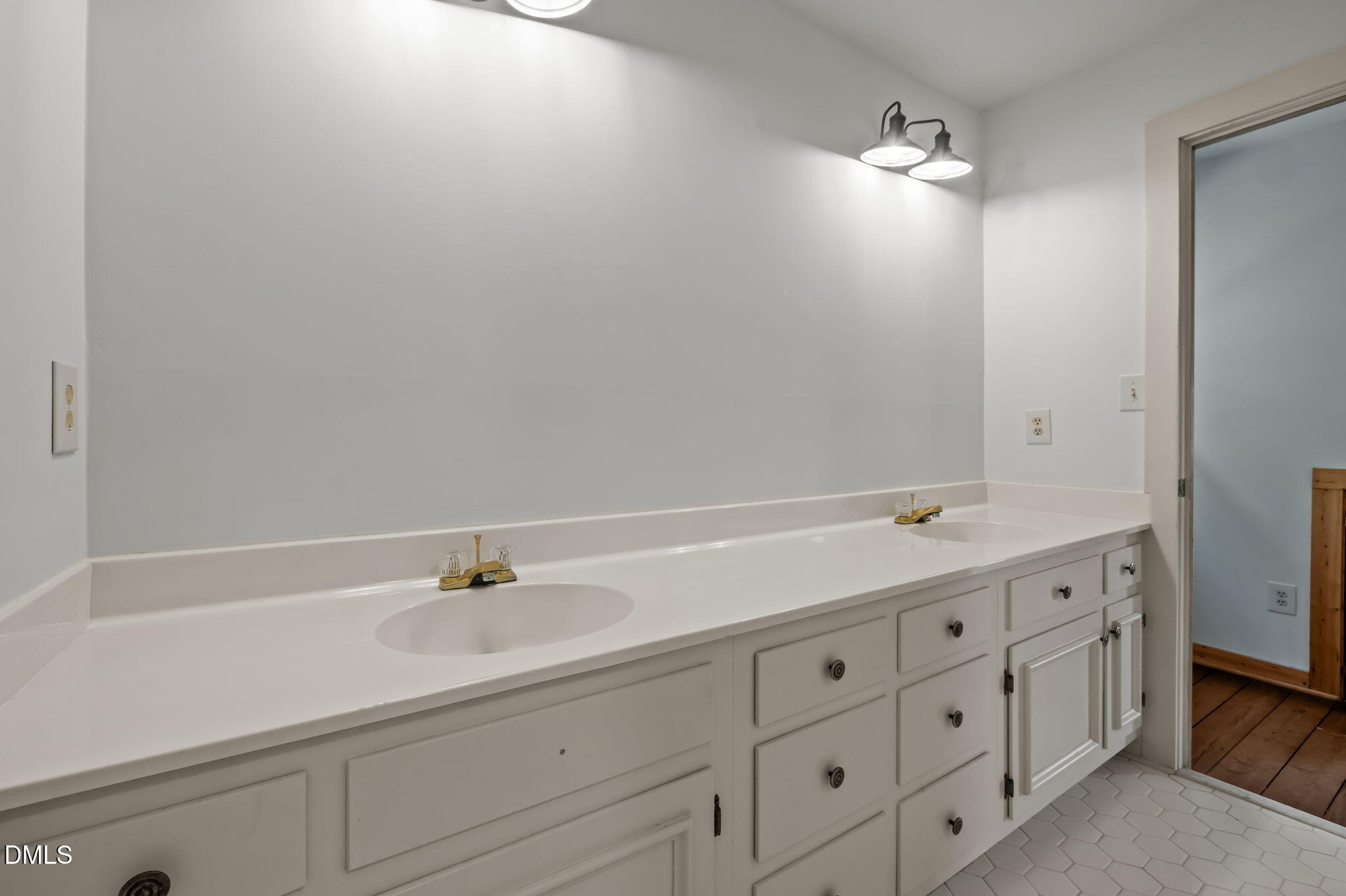 643 Old Stonehouse Road Chapel Hill, NC 27516 - Photo 35 of 63 a bathroom with a sink and a mirror