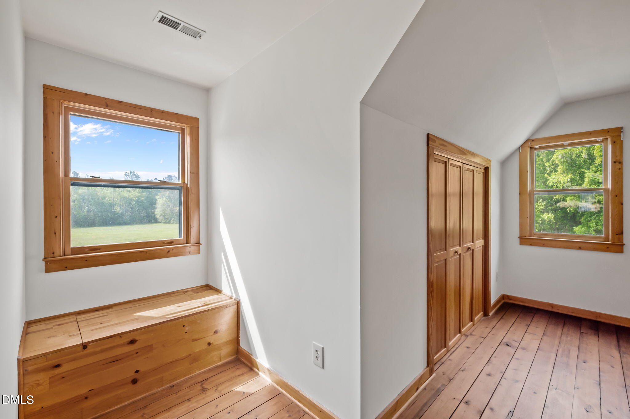 643 Old Stonehouse Road Chapel Hill, NC 27516 - Photo 40 of 63 a view of hallway with a window and wooden floor