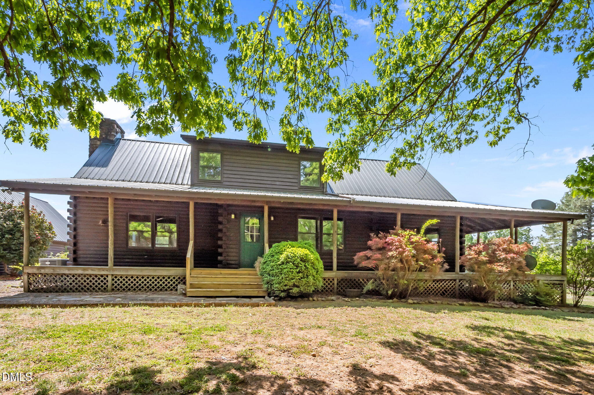643 Old Stonehouse Road Chapel Hill, NC 27516 - Photo 48 of 63 a view of a house with potted plants and a large tree
