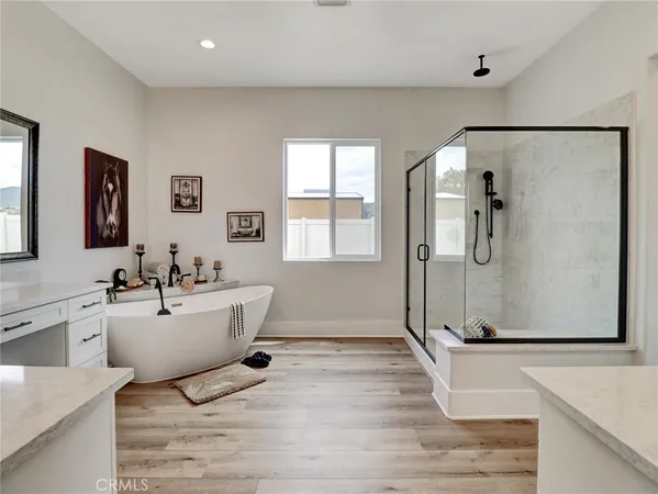 a room with wooden floor and white walls