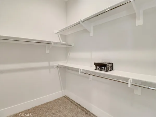 a view of an empty walk in closet