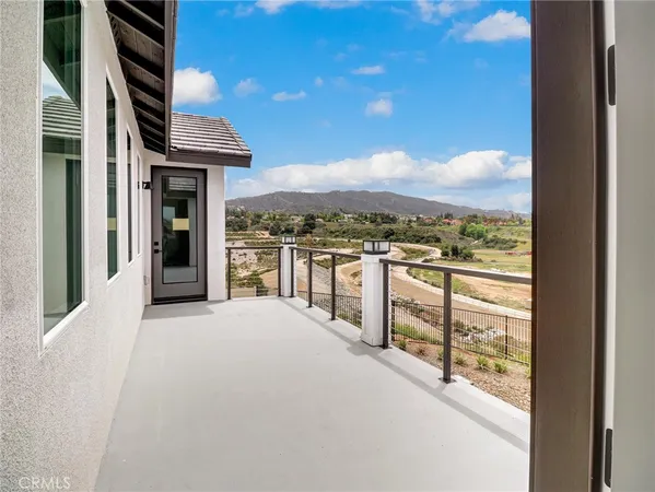 a view of a balcony with an ocean view