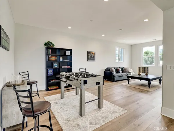 a living room with furniture a rug and a window