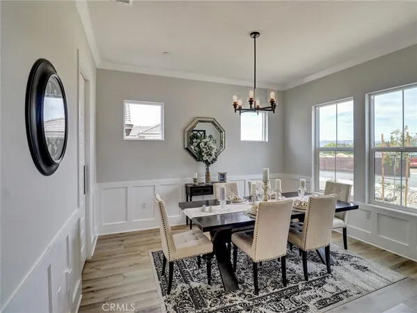a view of a dining room with furniture window and chandelier