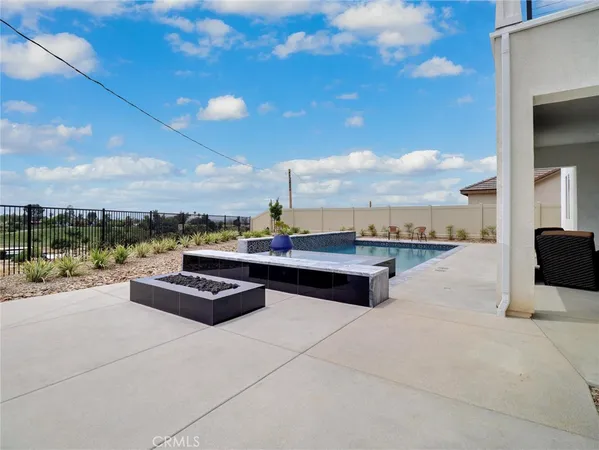a view of roof deck with patio