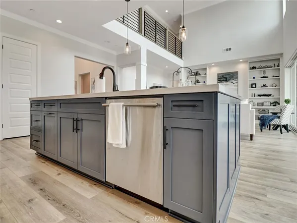 a kitchen with stainless steel appliances granite countertop a refrigerator and a stove