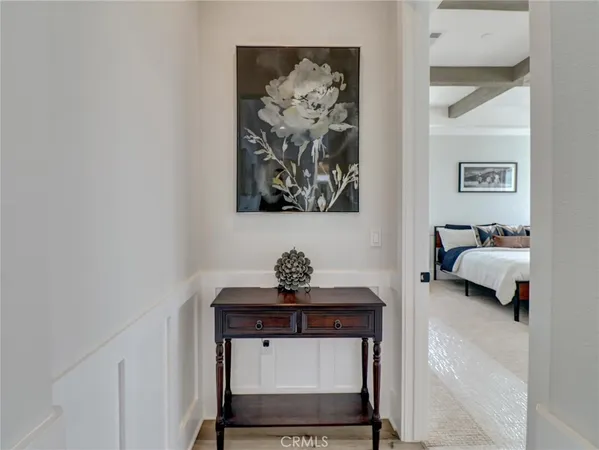 a living room with furniture and a mirror