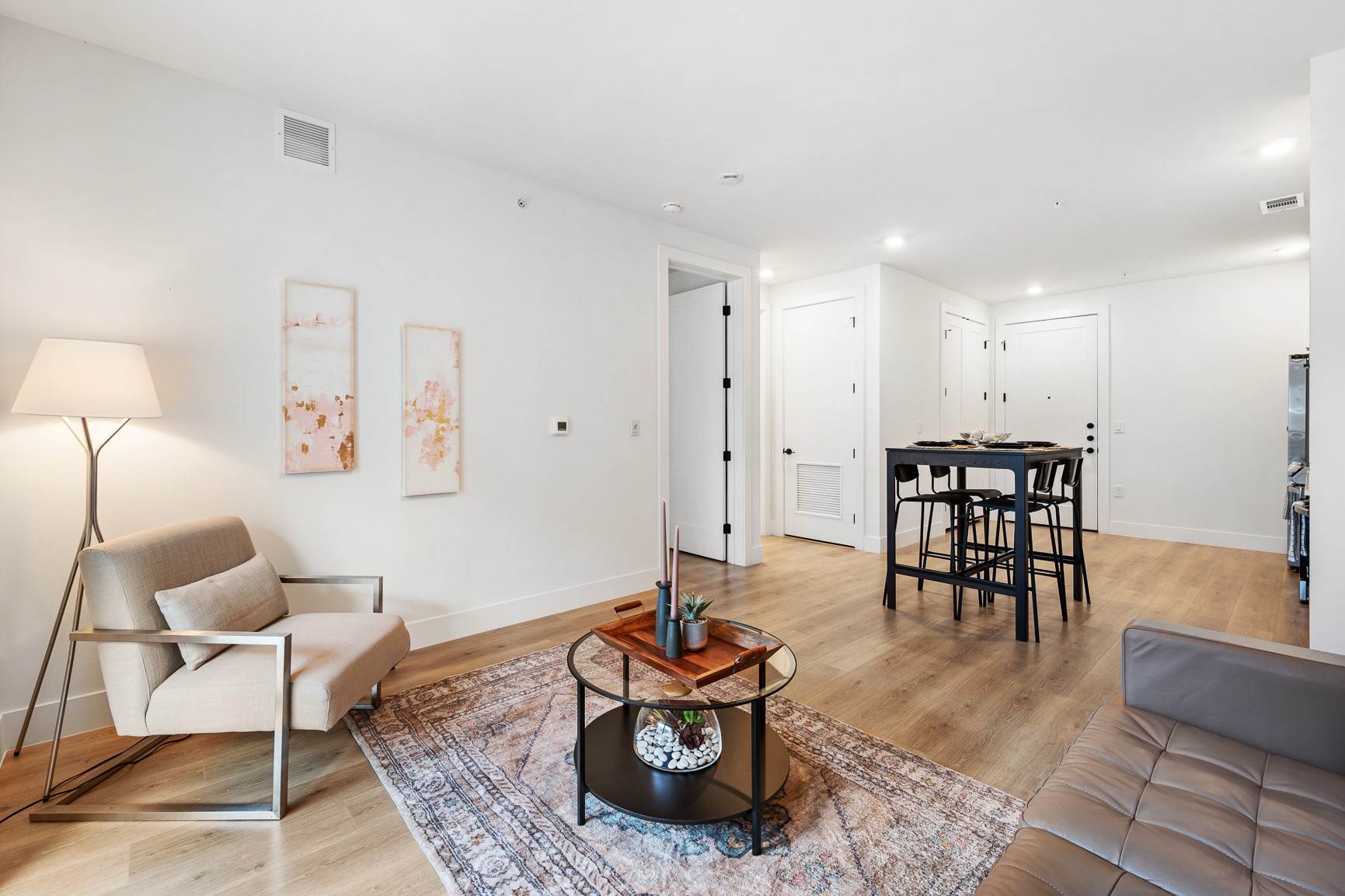 1701 Simond Avenue, Unit 201 Austin, TX 78723 - Photo 5 of 20 a living room with furniture and wooden floor