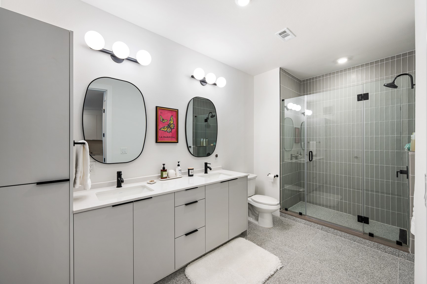 1701 Simond Avenue, Unit 201 Austin, TX 78723 - Photo 9 of 20 a bathroom with 2 sink and a mirror