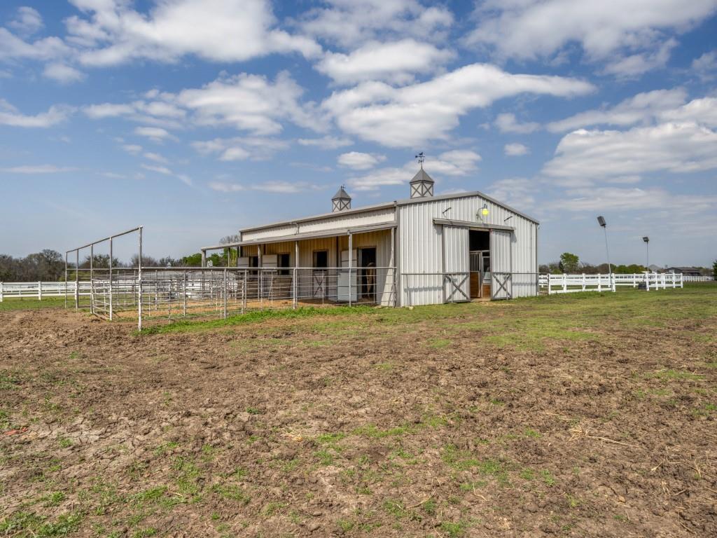 136 Parkside Court Gunter, TX 75058 - Photo 10 of 13 a view of a house with a yard