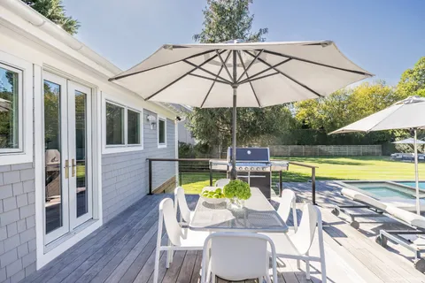 a view of a swimming pool with a patio