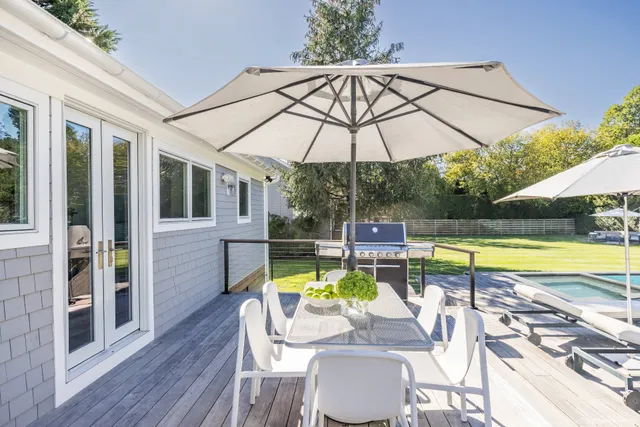 a view of a swimming pool with a patio