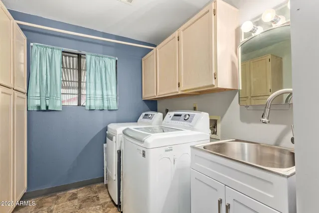 a bathroom with a granite countertop sink a toilet and a mirror