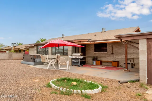 a view of a swimming pool with a patio