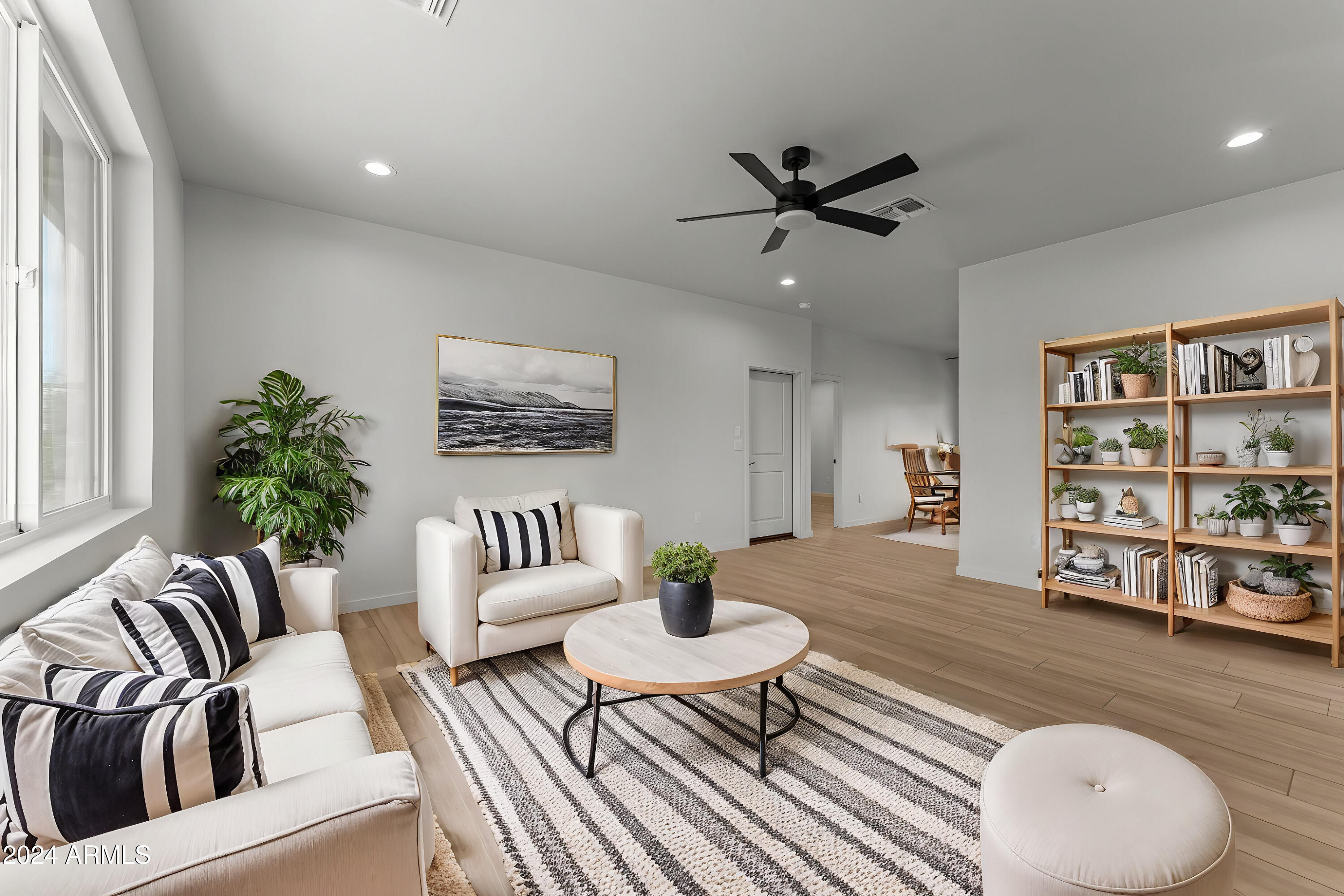 18473 Henry Coe Road Peeples Valley, AZ 86332 - Photo 11 of 31 a living room with furniture and a wooden floor