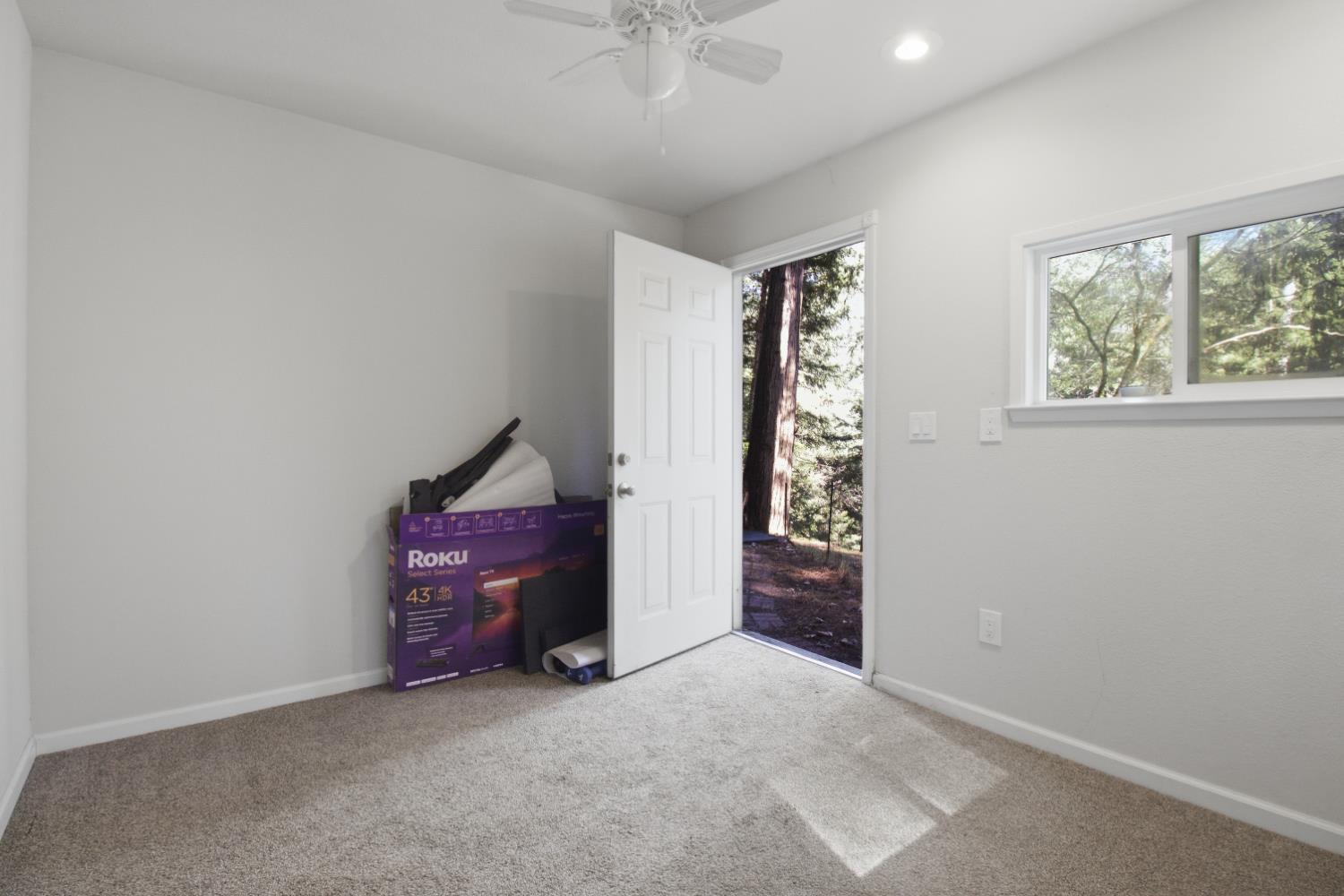 4599 Rivendale Road Placerville, CA 95667 - Photo 18 of 27 an empty room with windows and fan