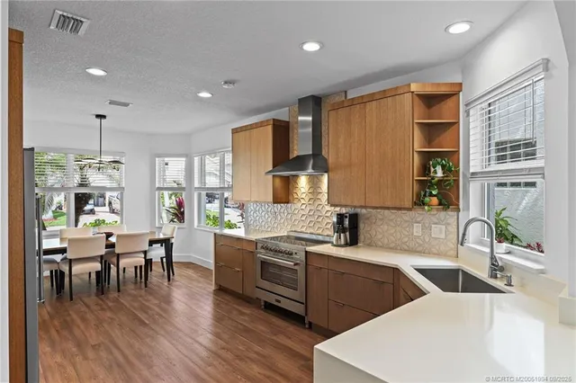a kitchen with lots of counter top space and dining table