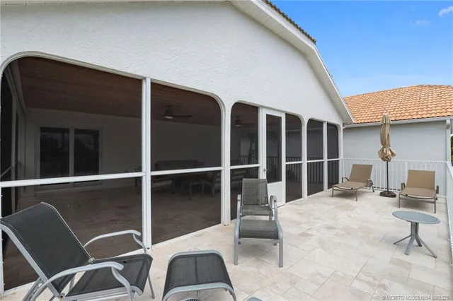 a view of a patio with a table chairs and a patio