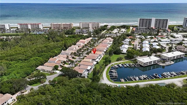 an aerial view of a house with outdoor space and street view