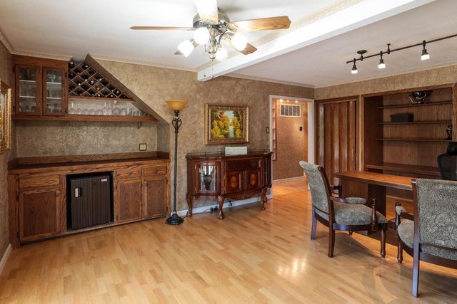 a view of a livingroom with furniture and a kitchen