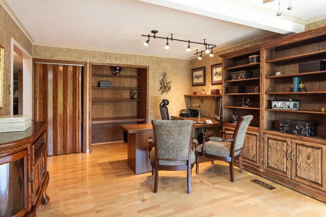 a view of a dining room with furniture and wooden floor