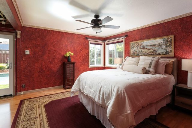 a bedroom with a bed and window