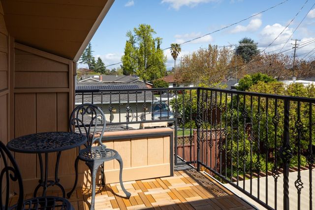 a view of a balcony with furniture
