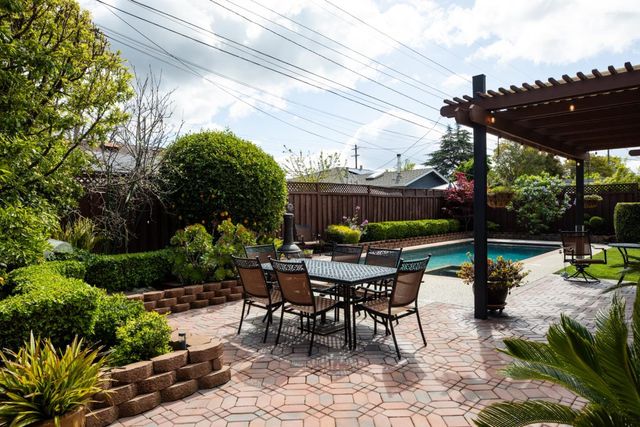 a view of chairs and tables in the patio