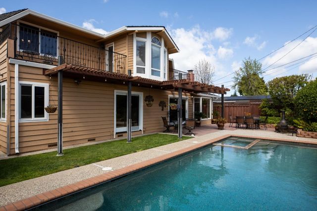 a front view of a house with swimming pool