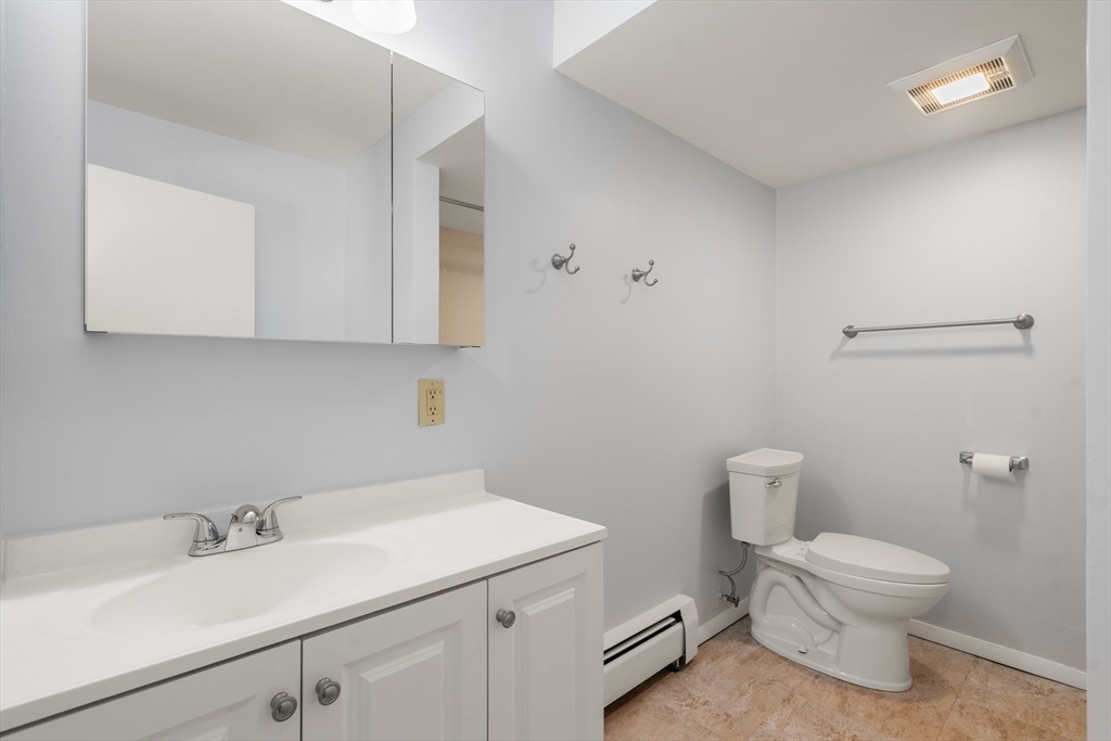 88 Beacon Street, Unit 7 Lawrence, MA 01843 - Photo 18 of 34 a bathroom with a sink toilet and vanity