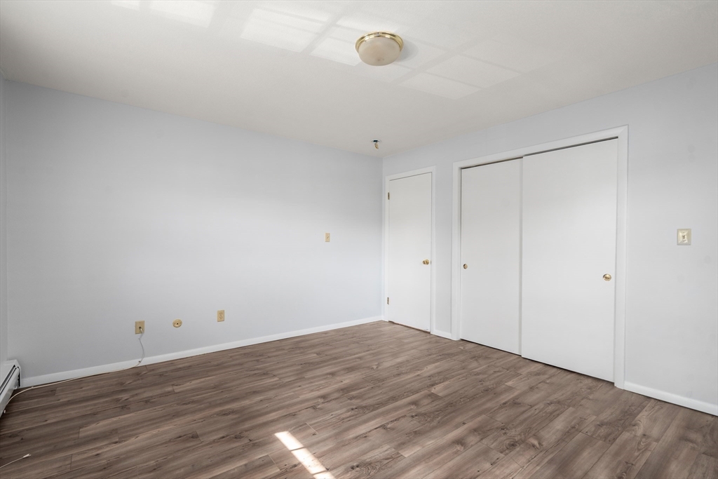 88 Beacon Street, Unit 7 Lawrence, MA 01843 - Photo 22 of 34 a view of empty room with wooden floor