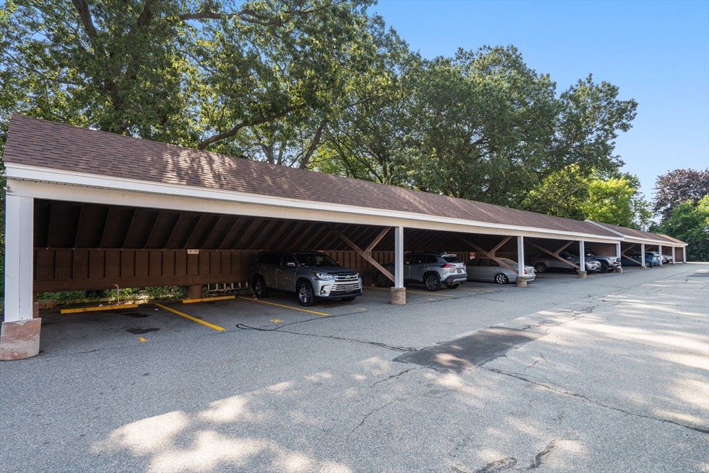 88 Beacon Street, Unit 7 Lawrence, MA 01843 - Photo 26 of 34 a view of a house with a yard and parking space
