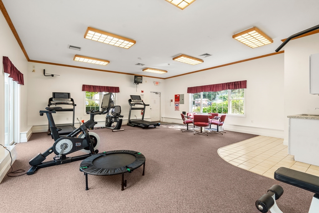 88 Beacon Street, Unit 7 Lawrence, MA 01843 - Photo 29 of 34 a room with gym equipment and a large window
