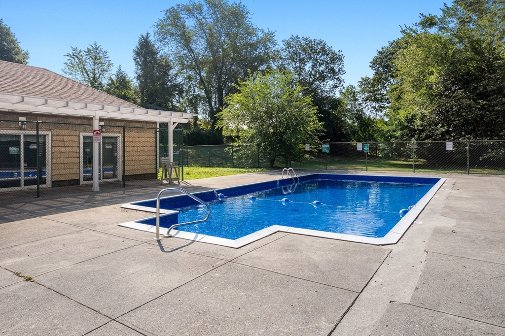 88 Beacon Street, Unit 7 Lawrence, MA 01843 - Photo 31 of 34 a view of a backyard with swimming pool and furniture