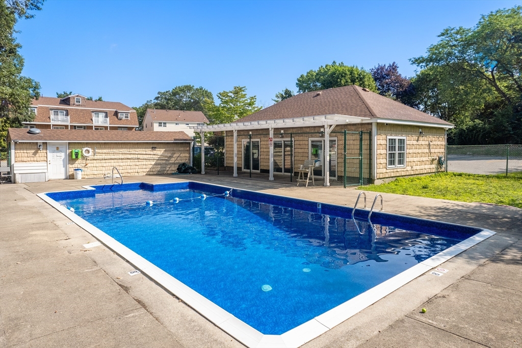 88 Beacon Street, Unit 7 Lawrence, MA 01843 - Photo 32 of 34 swimming pool view with a seating space and a view of a house
