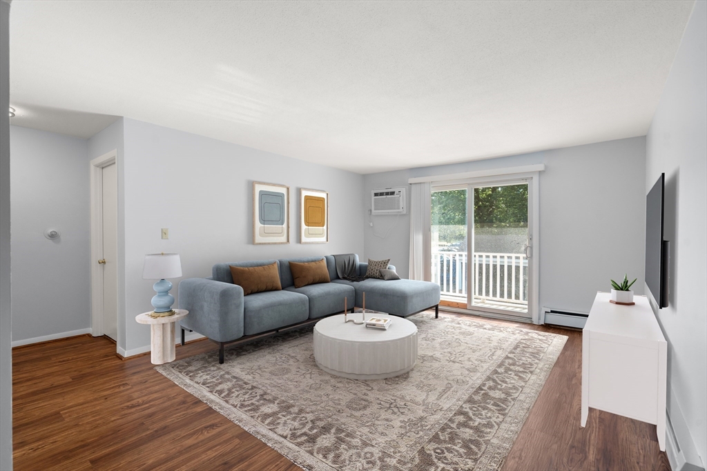 88 Beacon Street, Unit 7 Lawrence, MA 01843 - Photo 9 of 34 a living room with furniture and a flat screen tv