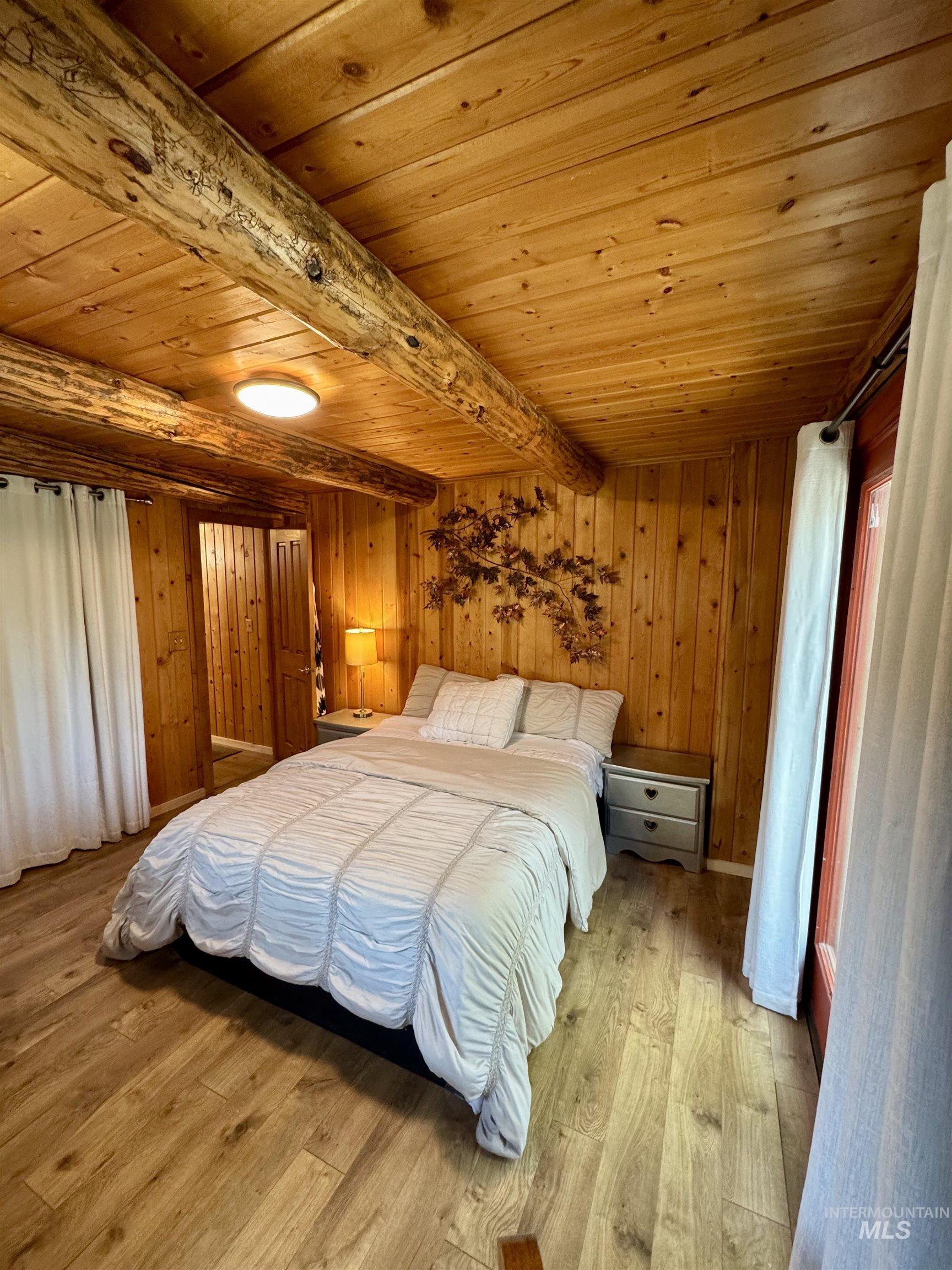 62 Bell Rapids Road Hagerman, ID 83332 - Photo 15 of 34 Wood-finish flooring complemented by paneled wood walls and a wood-plank ceiling