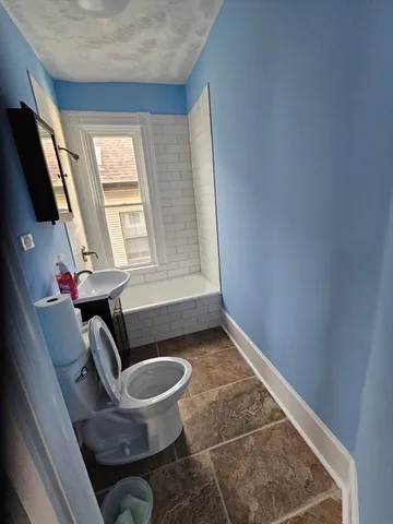 a view of a livingroom with furniture and windows