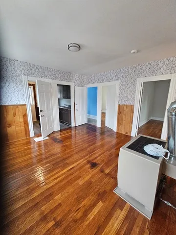 a view of a livingroom with furniture and wooden floor