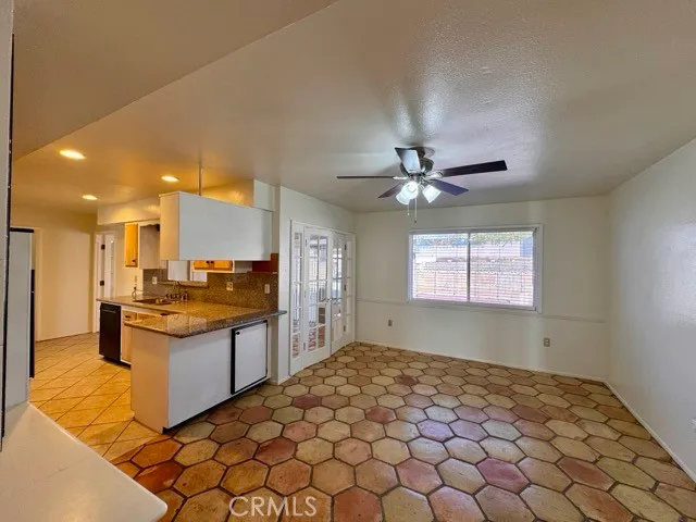 a kitchen with stainless steel appliances granite countertop a sink and a stove