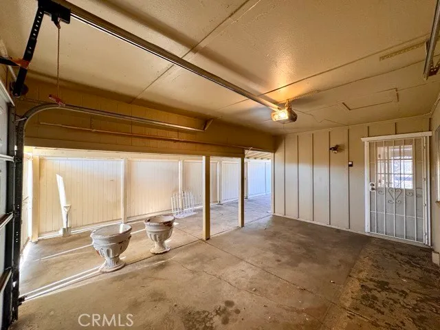 a view of a room with large windows